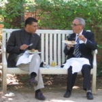Richard Wills and Jürgen Moltmann conversing during lunch