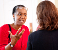 Traci West speaking with a SILT participant